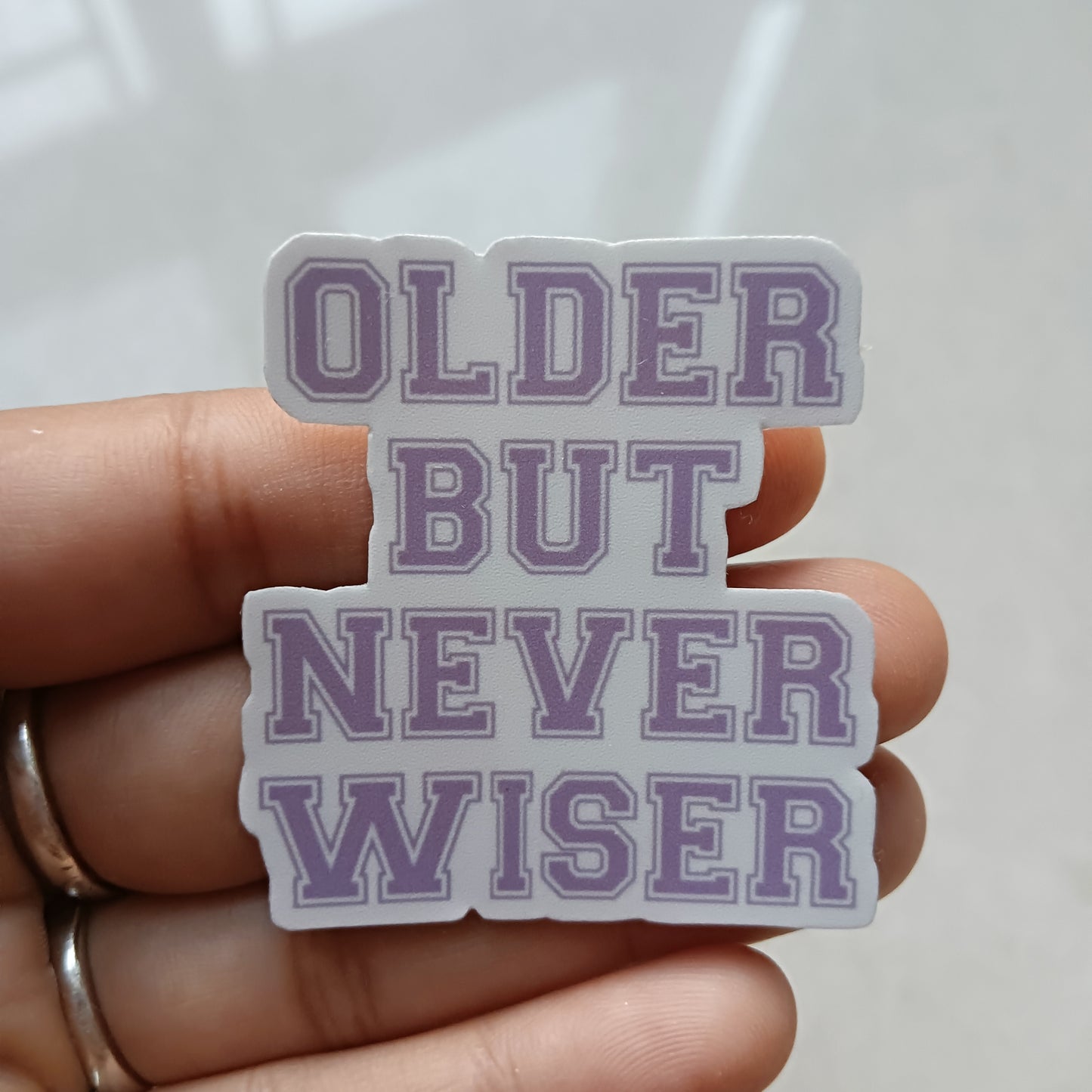 Never Wiser die-cut sticker